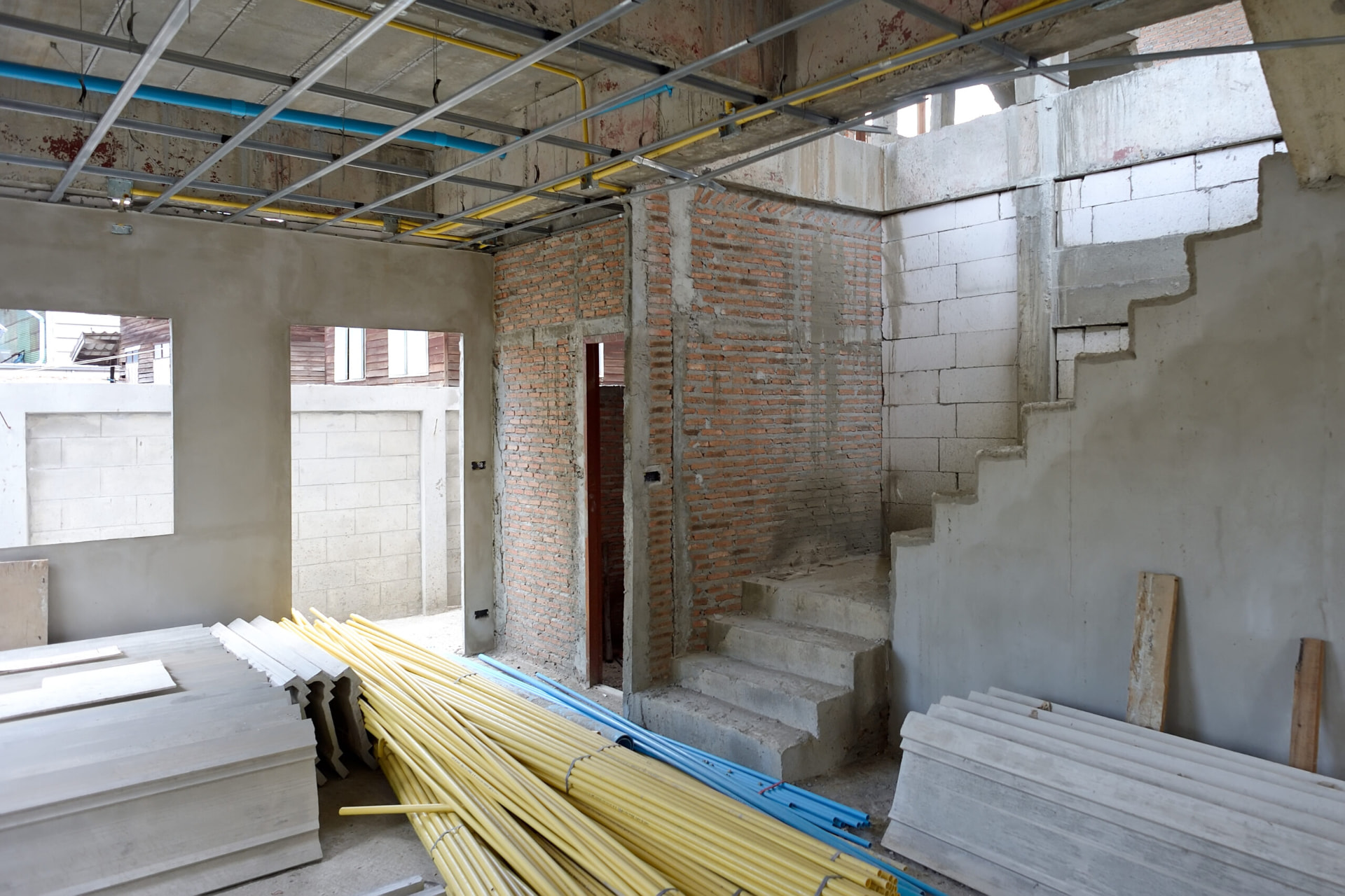 Internal walls and stairway stripped back during a full house renovation in Wolverhampton