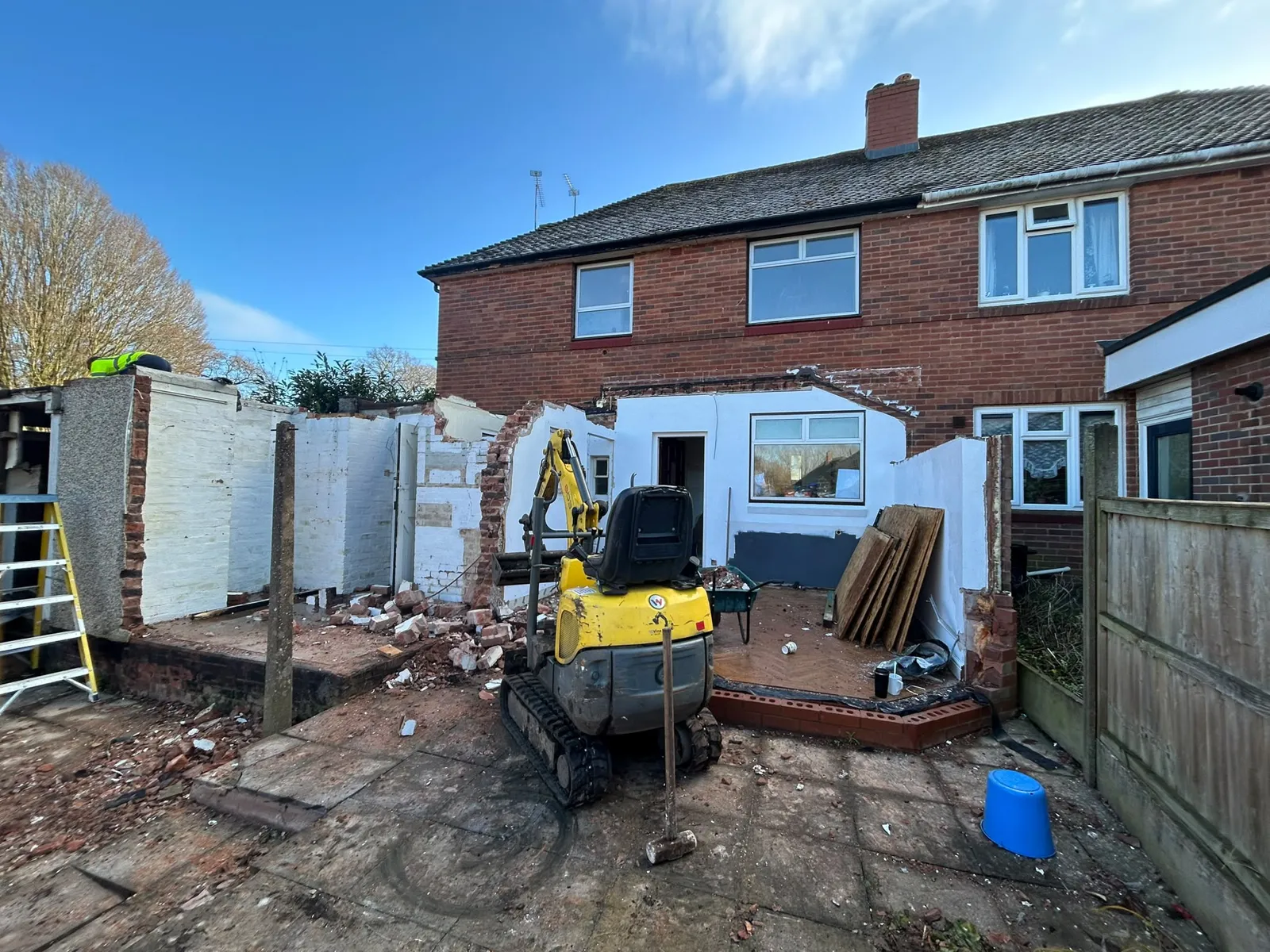 Cleared site at the rear of the Tettenhall Wood house with a mini digger