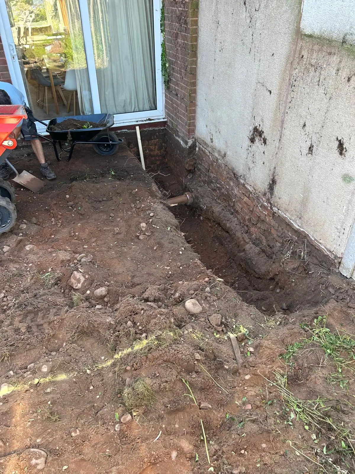 Excavated foundation trench and drainage connection at the rear of a Wombourne property