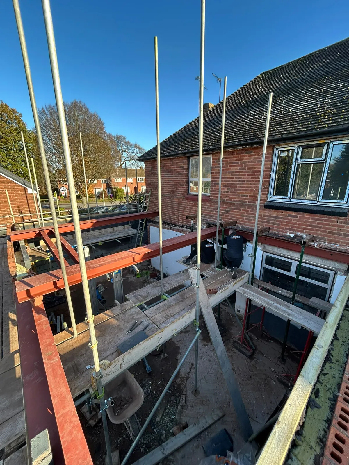 The steel H-frame seen from the scaffold, posts and beams in place