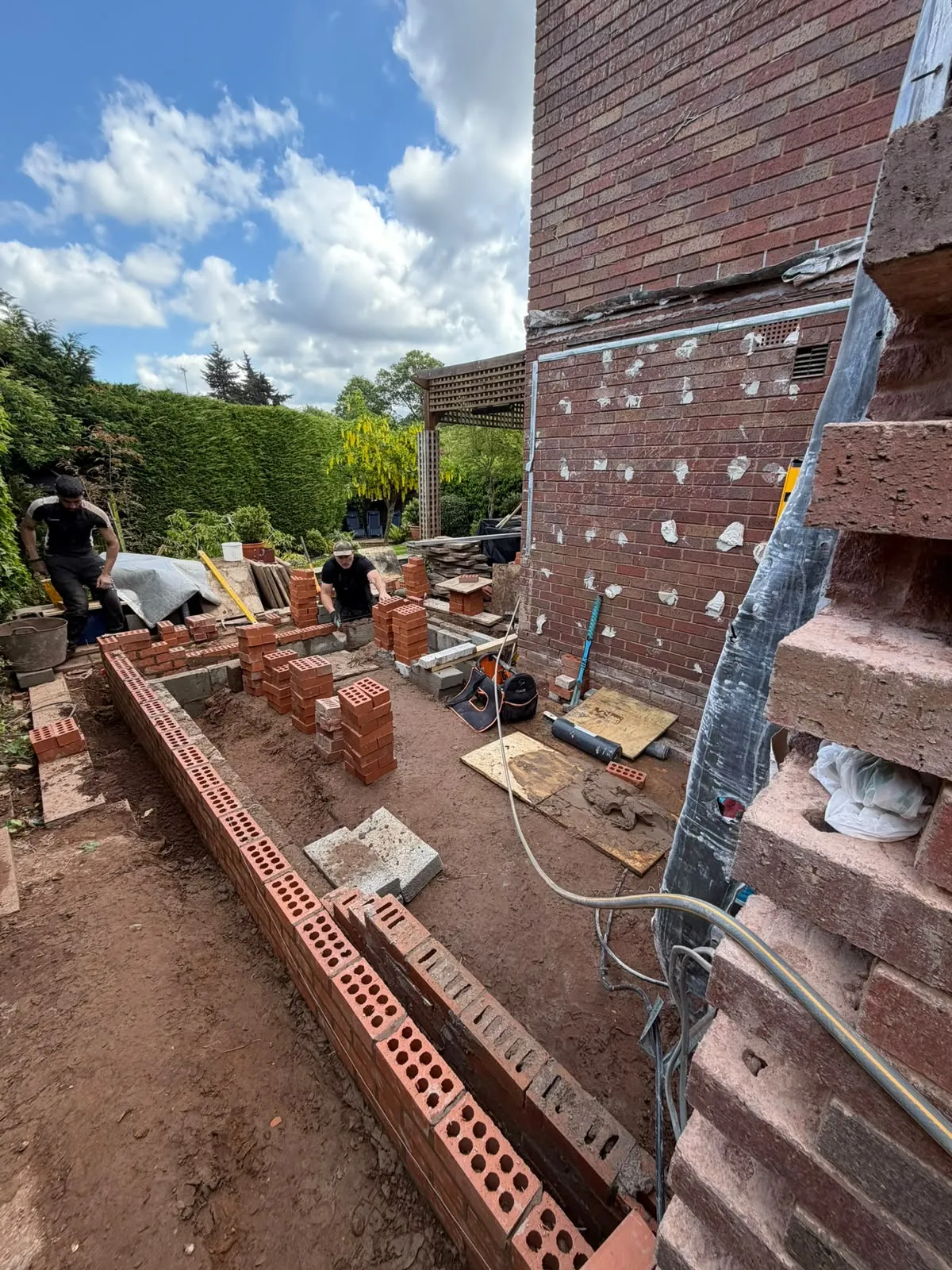 Facing brickwork rising on the new orangery walls