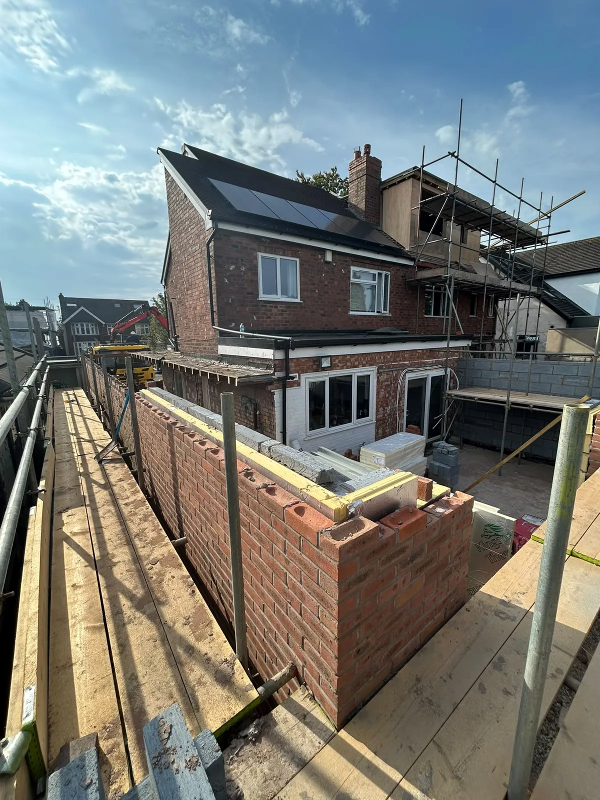 First-floor brickwork rising on the extension