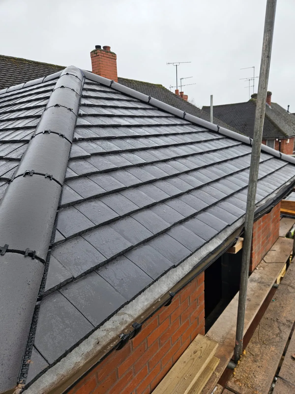 The new pitched roof tiled in grey