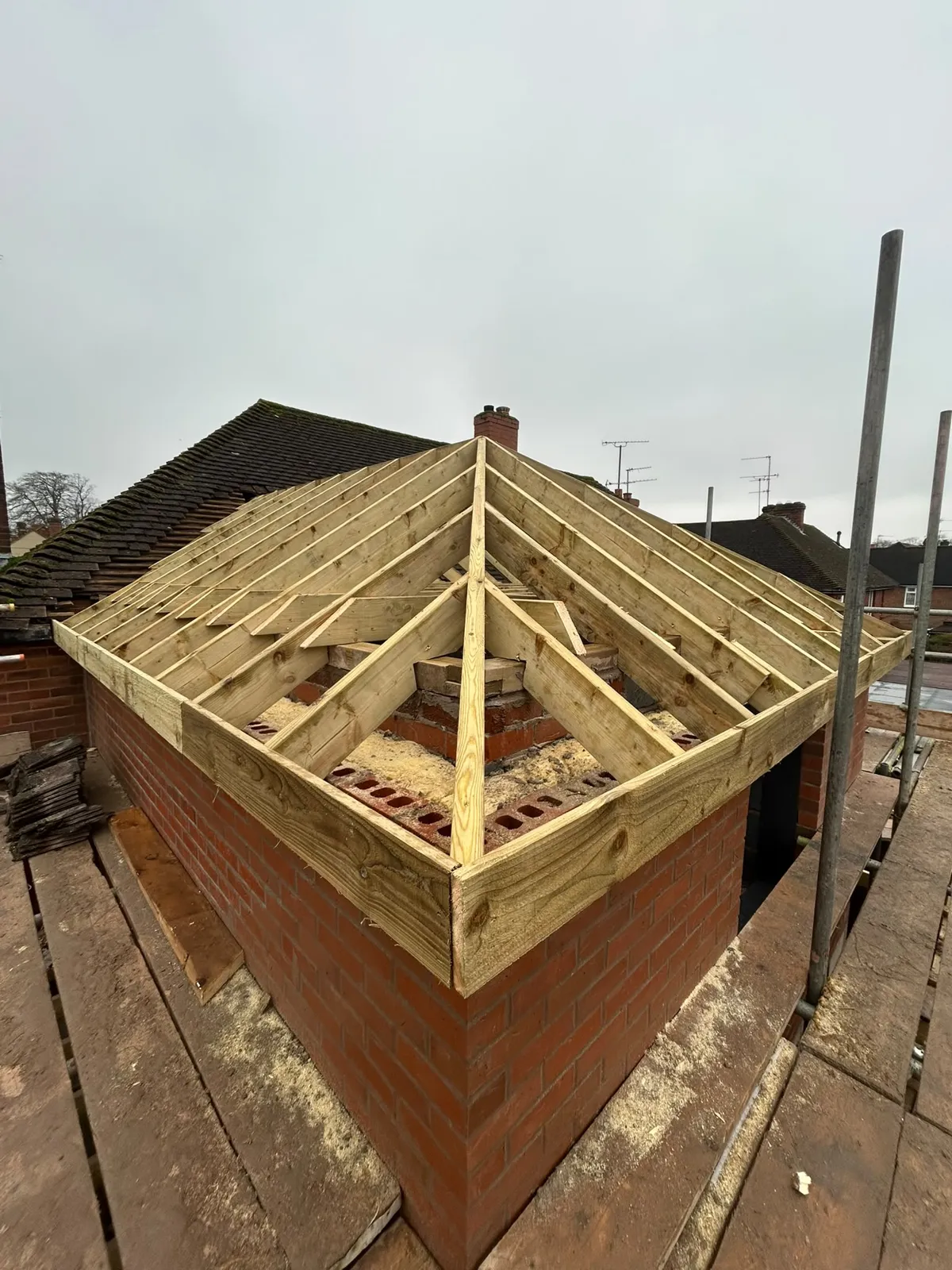 Timber hip roof structure on the new bedroom