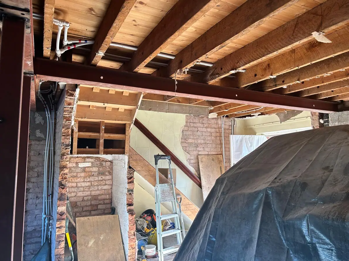 Internal structural steelwork installed after removing walls in a house renovation