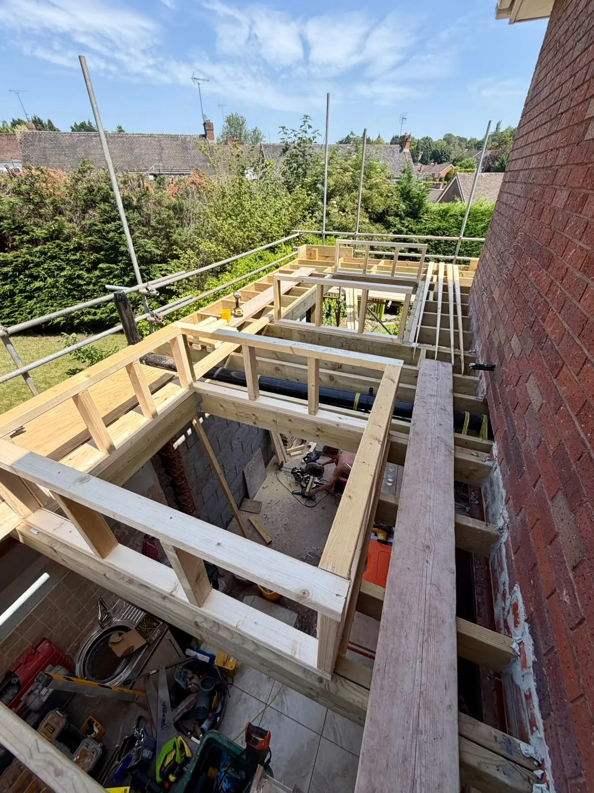 Warm-deck roof build-up with both skylight apertures framed